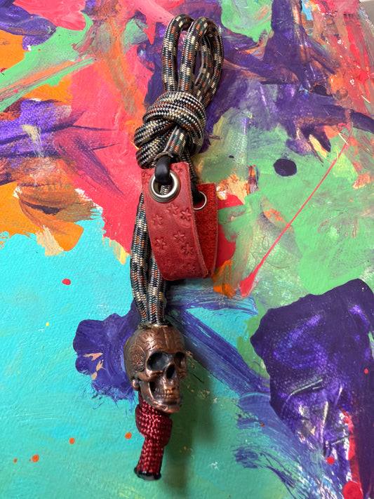 Dark Camo Paracord EDC - Frameless Slingshot w/ Skull Charm- Red Leather