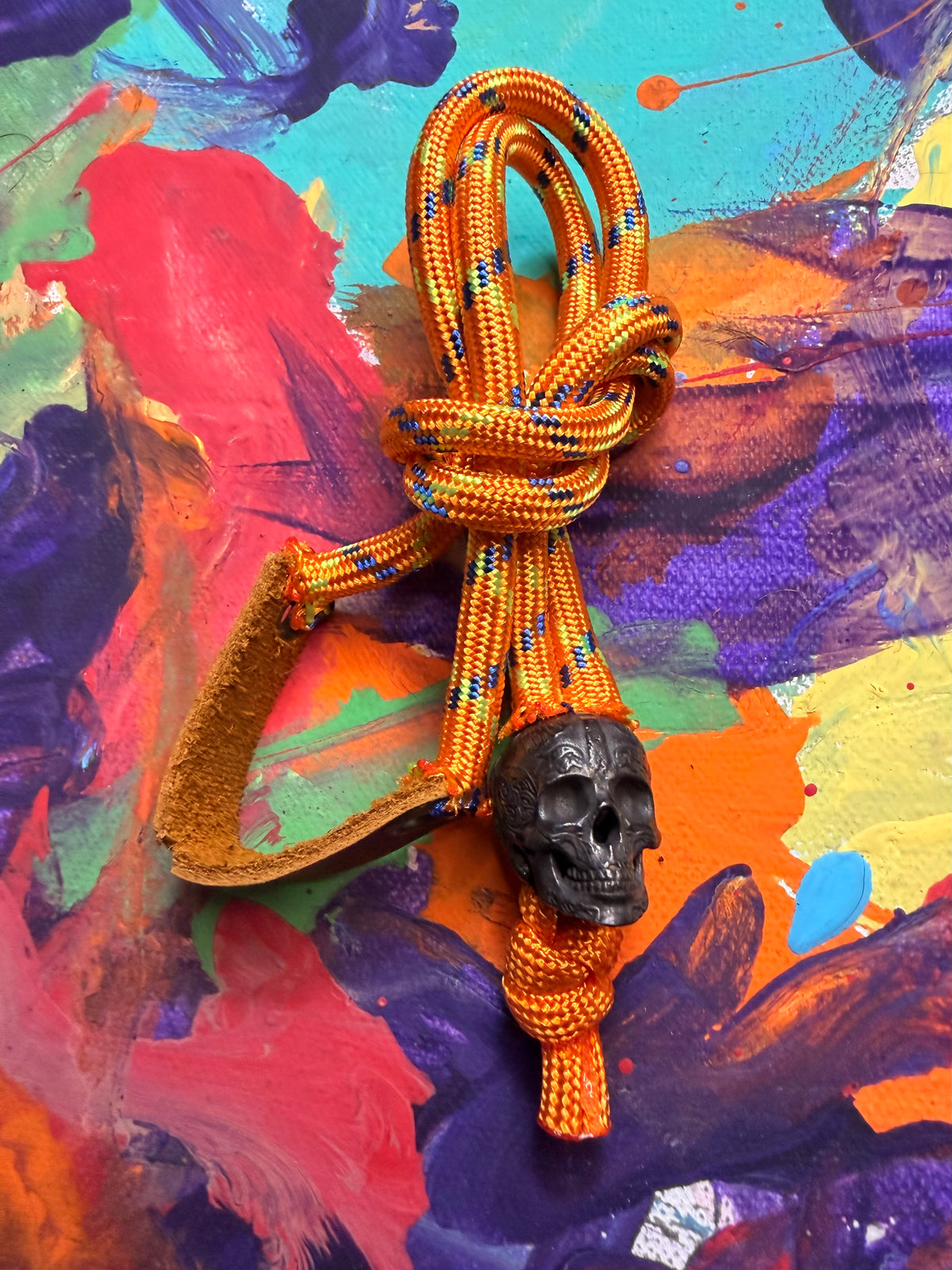 Neon Orange Paracord EDC - Frameless Slingshot w/ Black Skull Charm- Genuine Leather