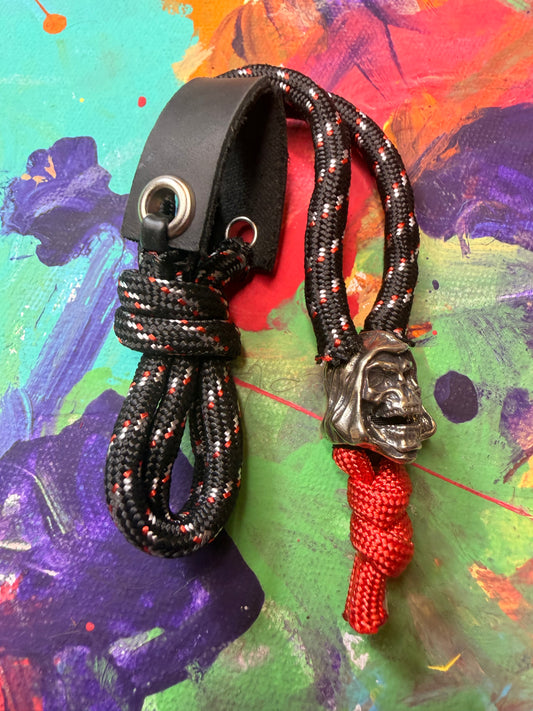 Black & Red Paracord EDC - Frameless Slingshot w/ Skeletor Charm- Black Leather