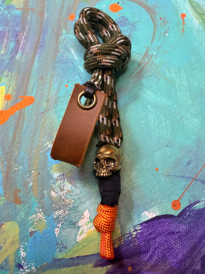 Green Camo Paracord EDC - Frameless Slingshot w/ Jawless Skull Charm - Genuine Leather