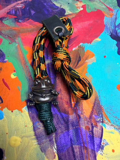 Green & Orange Paracord EDC - Frameless Slingshot w/ Frog Charm - Green Leather