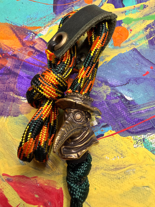 Orange Yellow & Black Paracord EDC - Frameless Slingshot w/ Plague Doctor Charm - Green Leather
