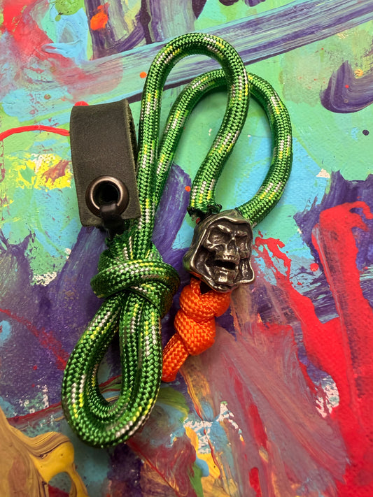 Green & Red Paracord EDC - Frameless Slingshot w/ Skeletor Charm- Green Leather