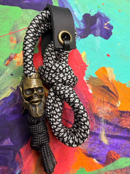 Black & White Paracord EDC - Frameless Slingshot w/ Viking Skull Charm - Black Leather