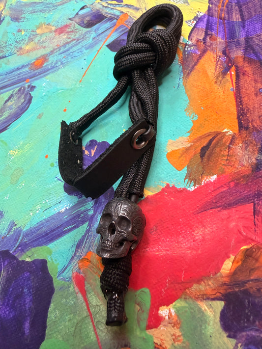 **Chris S. Custom** Black On Black Paracord EDC - Frameless Slingshot w/ Skull Charm - Black Leather