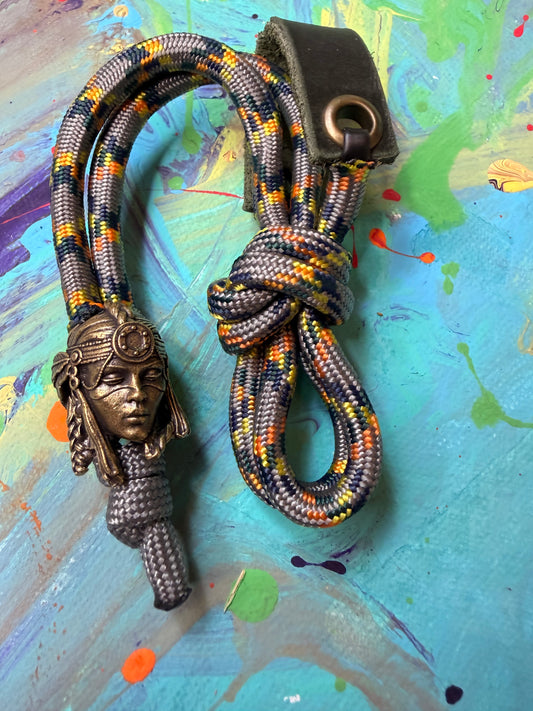 Gray & Orange Paracord EDC - Frameless Slingshot w/ Egyptian Queen Charm - Green Leather