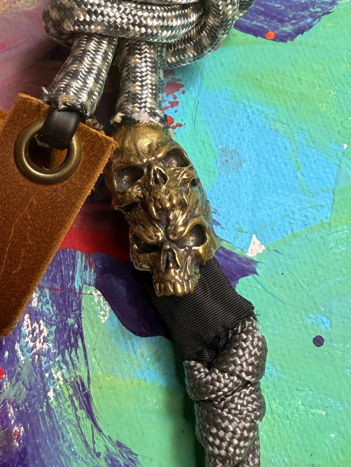 Gray & White Paracord EDC - Frameless Slingshot w/ Double Skull Charm - Genuine Leather
