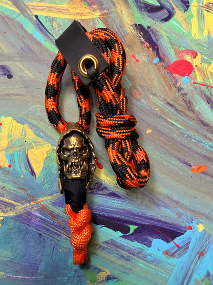 Orange & Black Paracord EDC - Frameless Slingshot w/ Monster Skull Charm - Black Leather