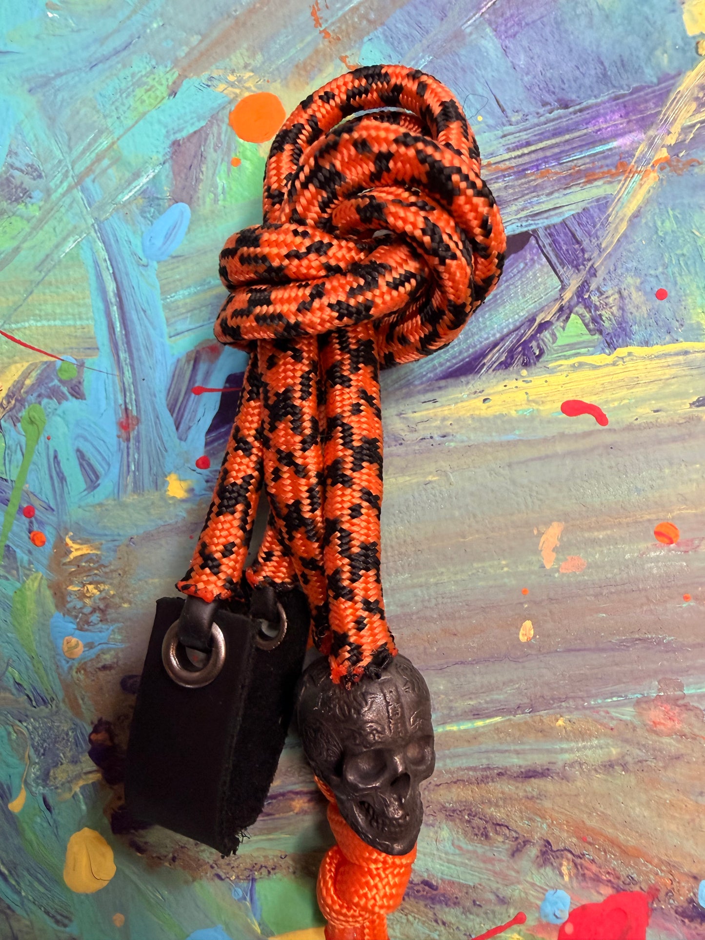 Orange & Black Paracord EDC - Frameless Slingshot w/ Black Skull Charm- Black Leather
